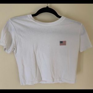 It is a white shirt from Brandy Melville.